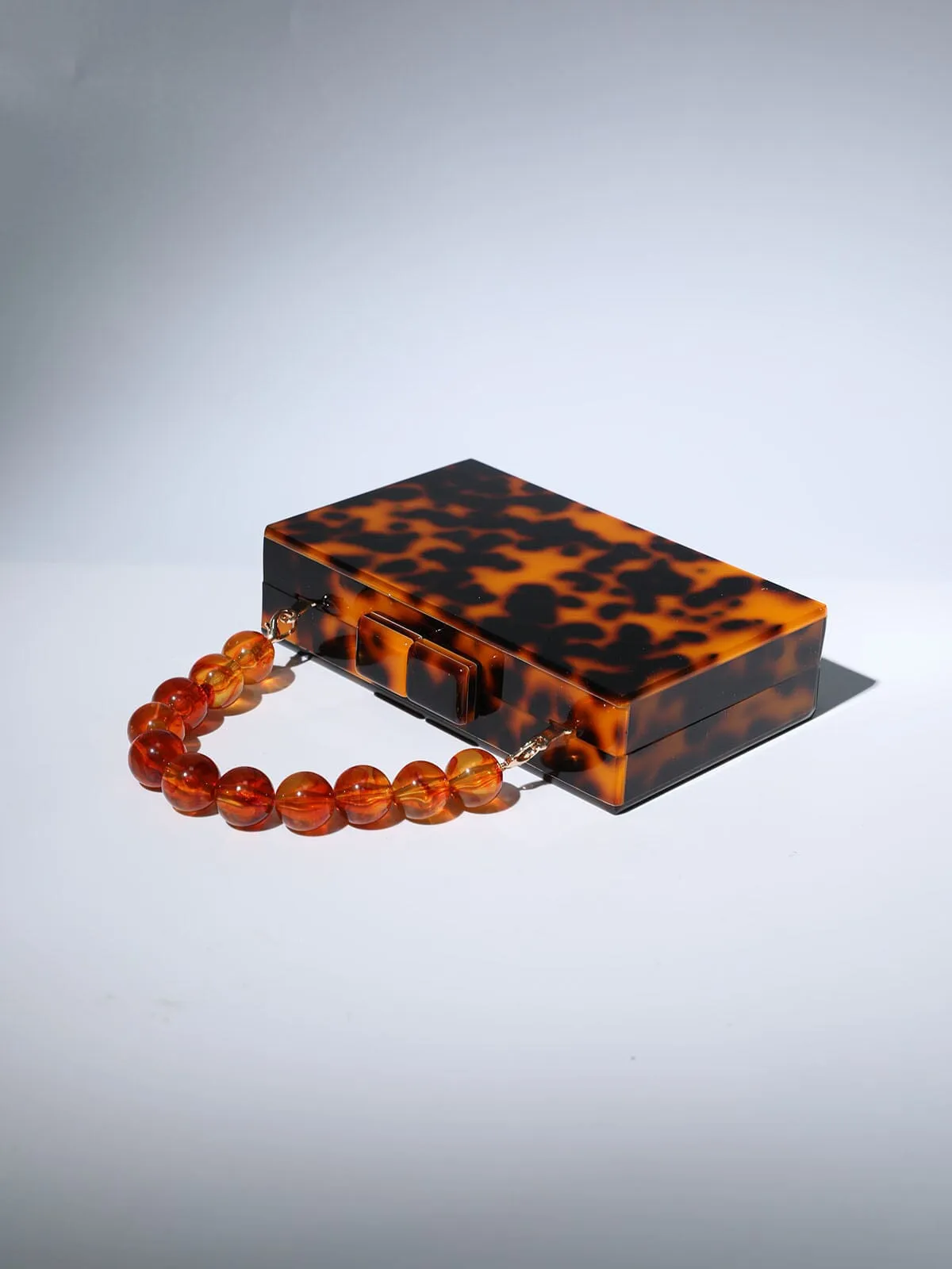 ACRYLIC BEADED CLUTCH IN AMBER Gloria Lanvin
